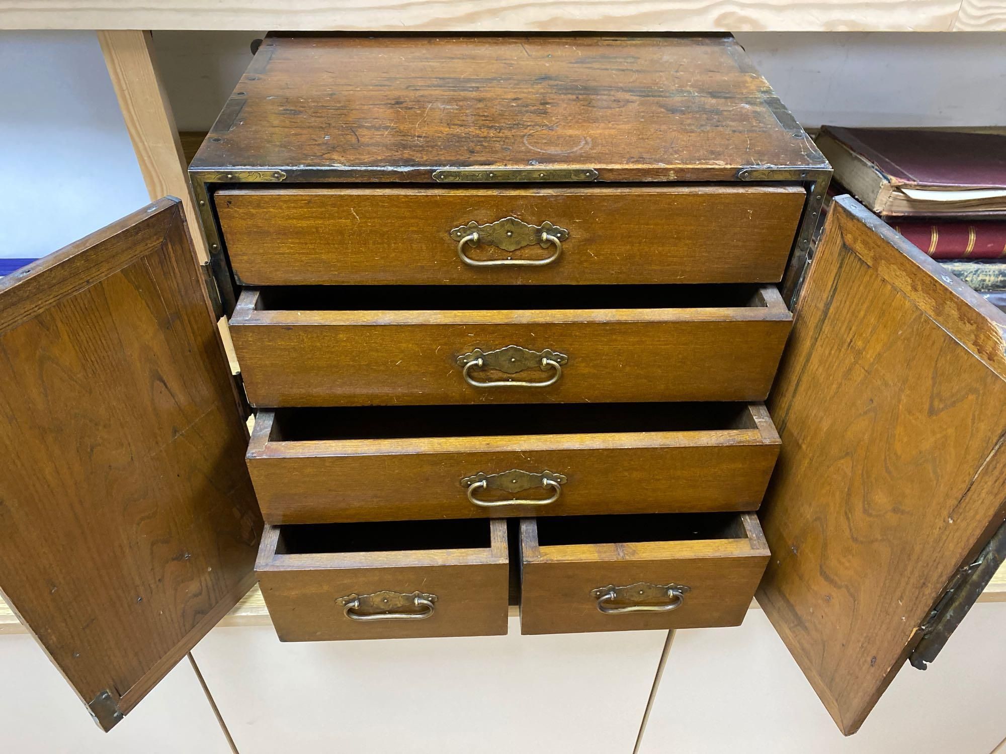 A Korean elm brass mounted table top cabinet